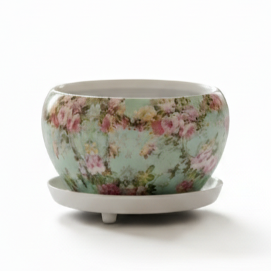 Floral-patterned ceramic pot on a white background