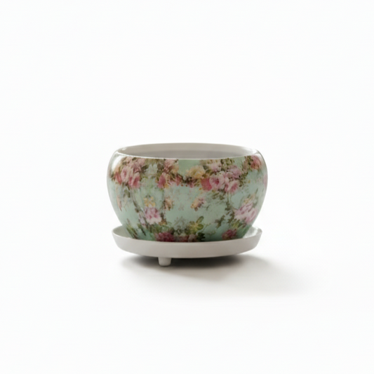 Floral-patterned ceramic pot on a white background