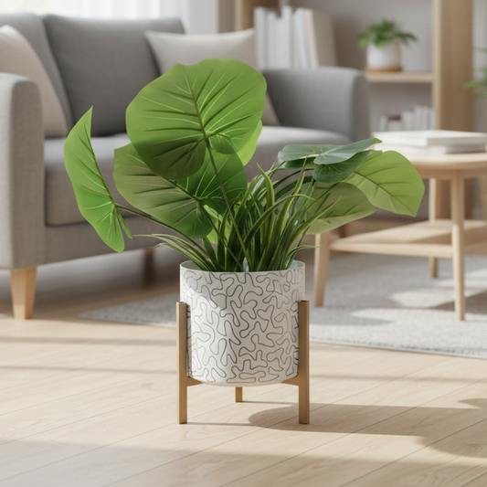 Potted plant on a stand in a living room setting with a sofa and bookshelf in the background.