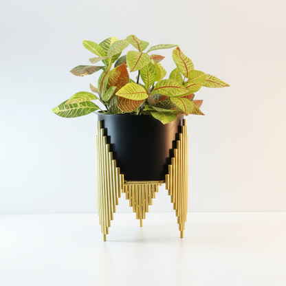 Modern black planter with gold geometric design on a white background