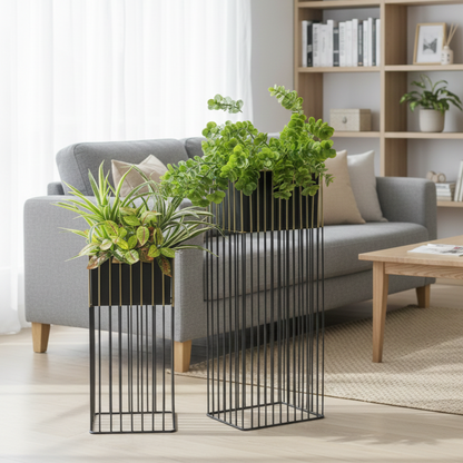 Black metal room divider with plants in a living room setting