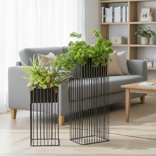 Black metal room divider with plants in a living room setting