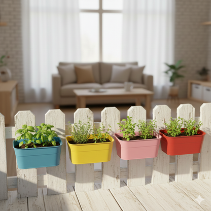 Colorful planters with plants on a wooden deck