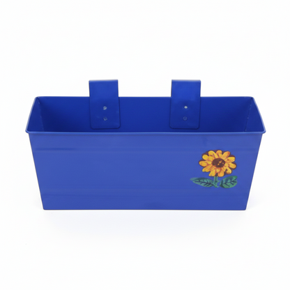 Four colorful metal planters with sunflower design on a white background