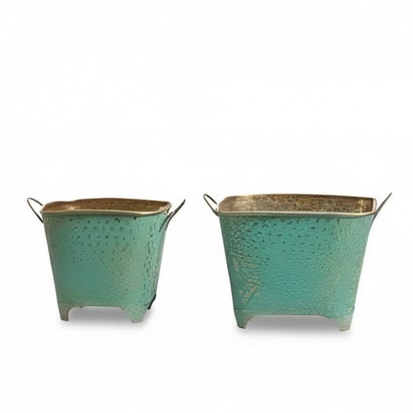 Two turquoise metal planters with gold accents on a white background