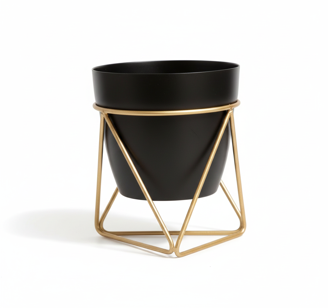 Black planter with gold geometric stand on a white background