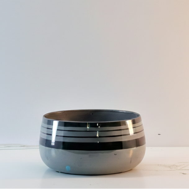 Ceramic bowl with black interior on a white background