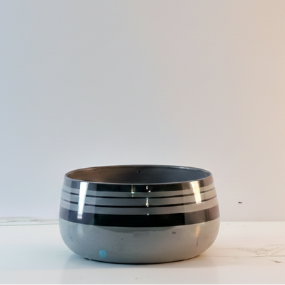 Ceramic bowl with black interior on a white background