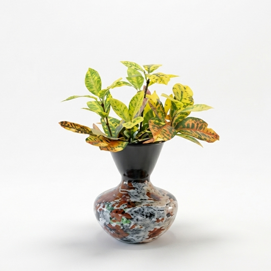 Decorative vase with a plant on a white background