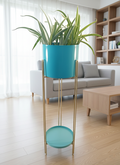 Turquoise planter with a plant on a gold stand in a living room setting.