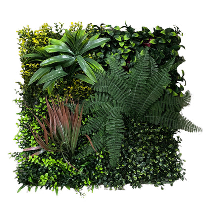 Artificial green wall with various types of plants on a white background