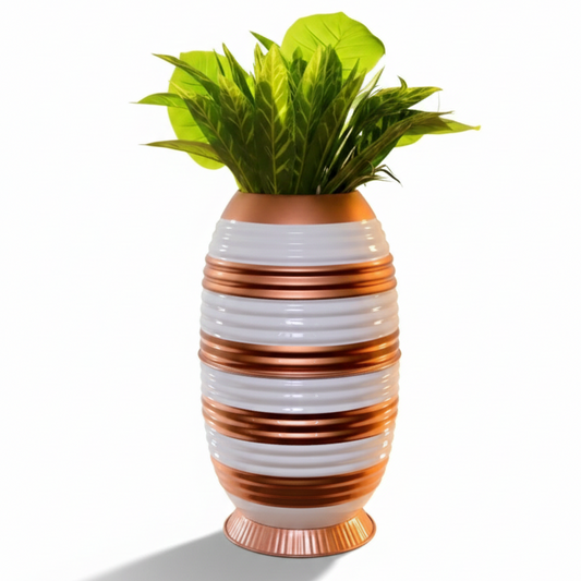 Decorative vase with striped pattern and green plant on a white background