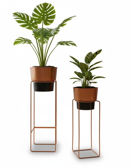 Two potted plants on metal stands against a white background