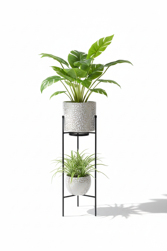Two potted plants on a black metal plant stand against a white background