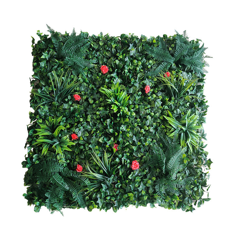 Square arrangement of artificial greenery with red flowers on a white background
