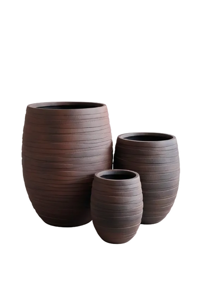 Three brown textured planters of different sizes on a white background