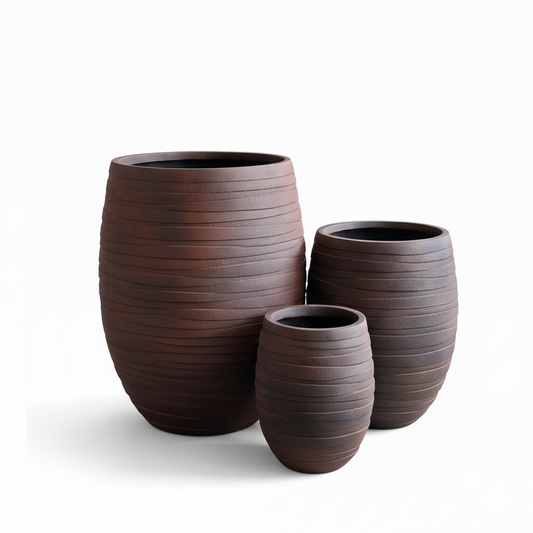 Three brown textured planters of different sizes on a white background