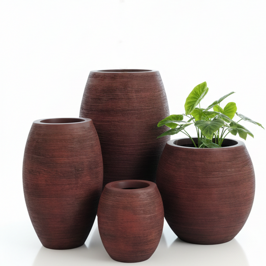Set of brown ceramic planters with a green plant on a white background
