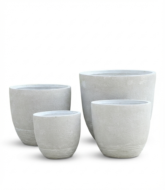 Set of four gray ceramic planters on a white background