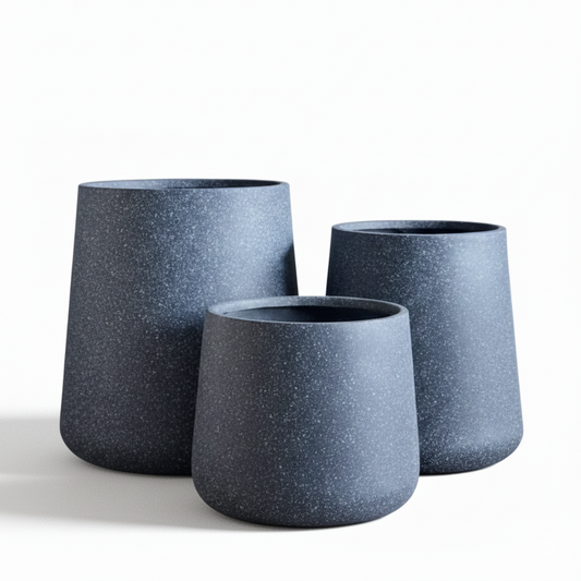 Three gray textured planters of different sizes on a white background