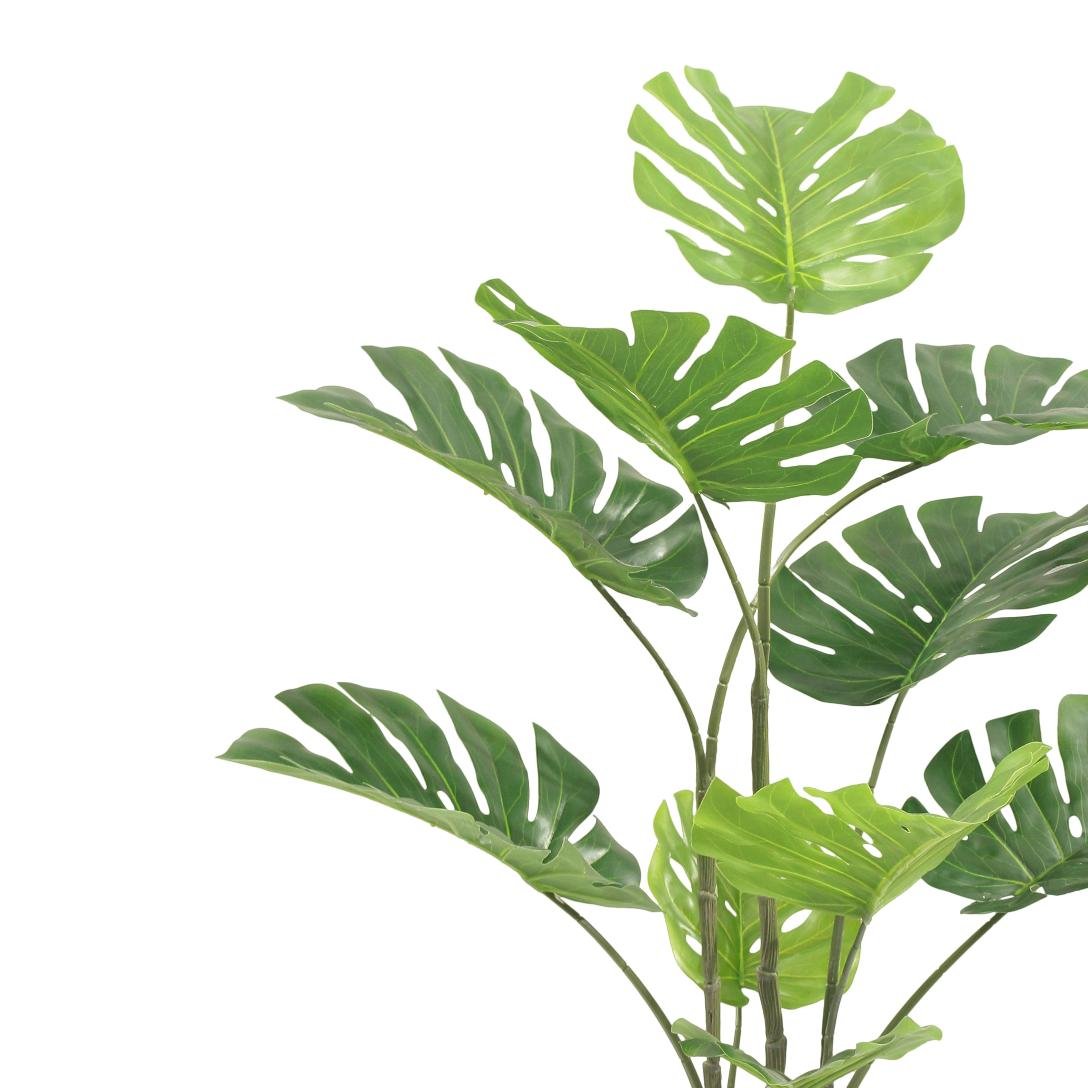 Artificial monstera plant on a white background