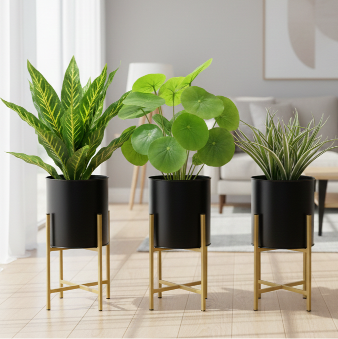 Three potted plants on stands in a modern living room.