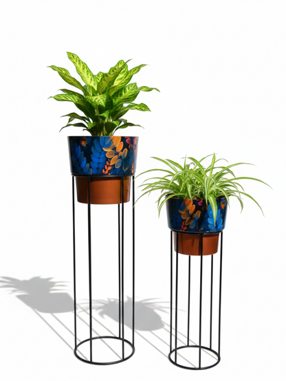 Two plant stands with colorful planters and plants on a white background