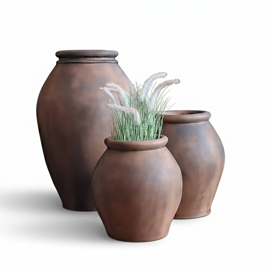 Three brown ceramic pots on a white background
