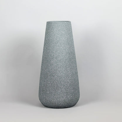 Gray textured vase on a light gray background