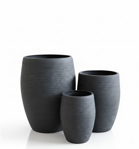 Three black textured planters of different sizes on a white background