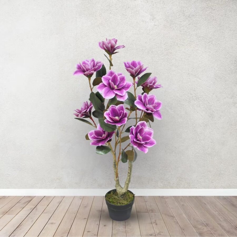 Potted plant with purple flowers on a wooden floor and light gray wall background