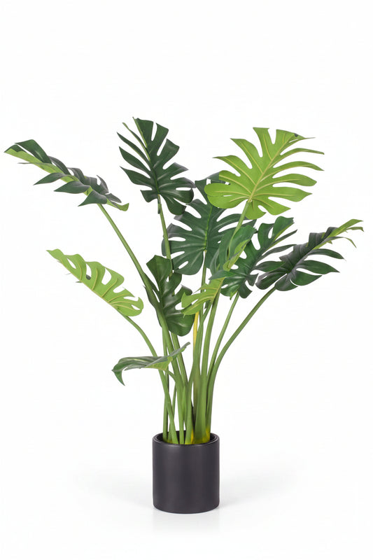 Artificial potted plant with green leaves on a white background