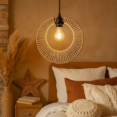 Cozy bedroom with warm lighting, pillows, and decorative elements.