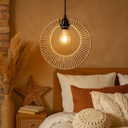 Cozy bedroom with warm lighting, pillows, and decorative elements.