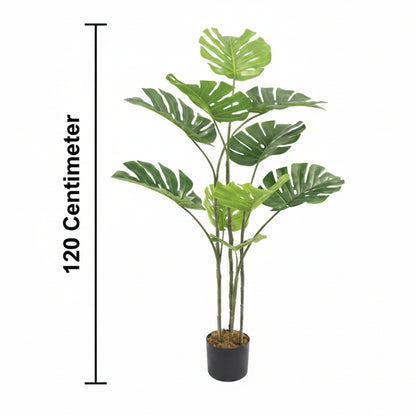 Artificial potted plant with green leaves and a measurement label on a white background