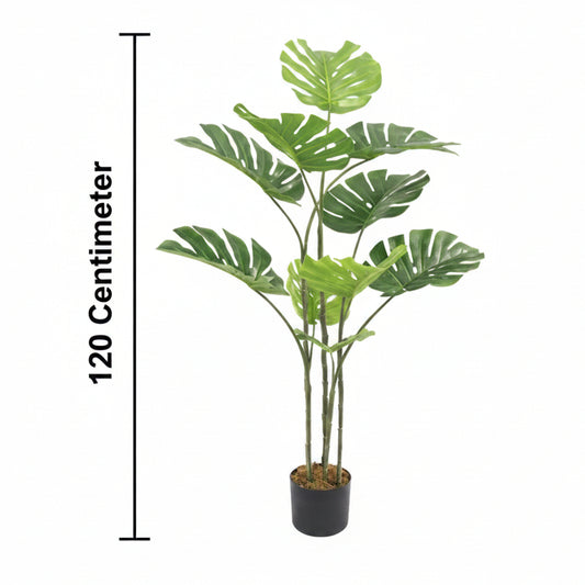 Artificial potted plant with green leaves and a measurement label on a white background