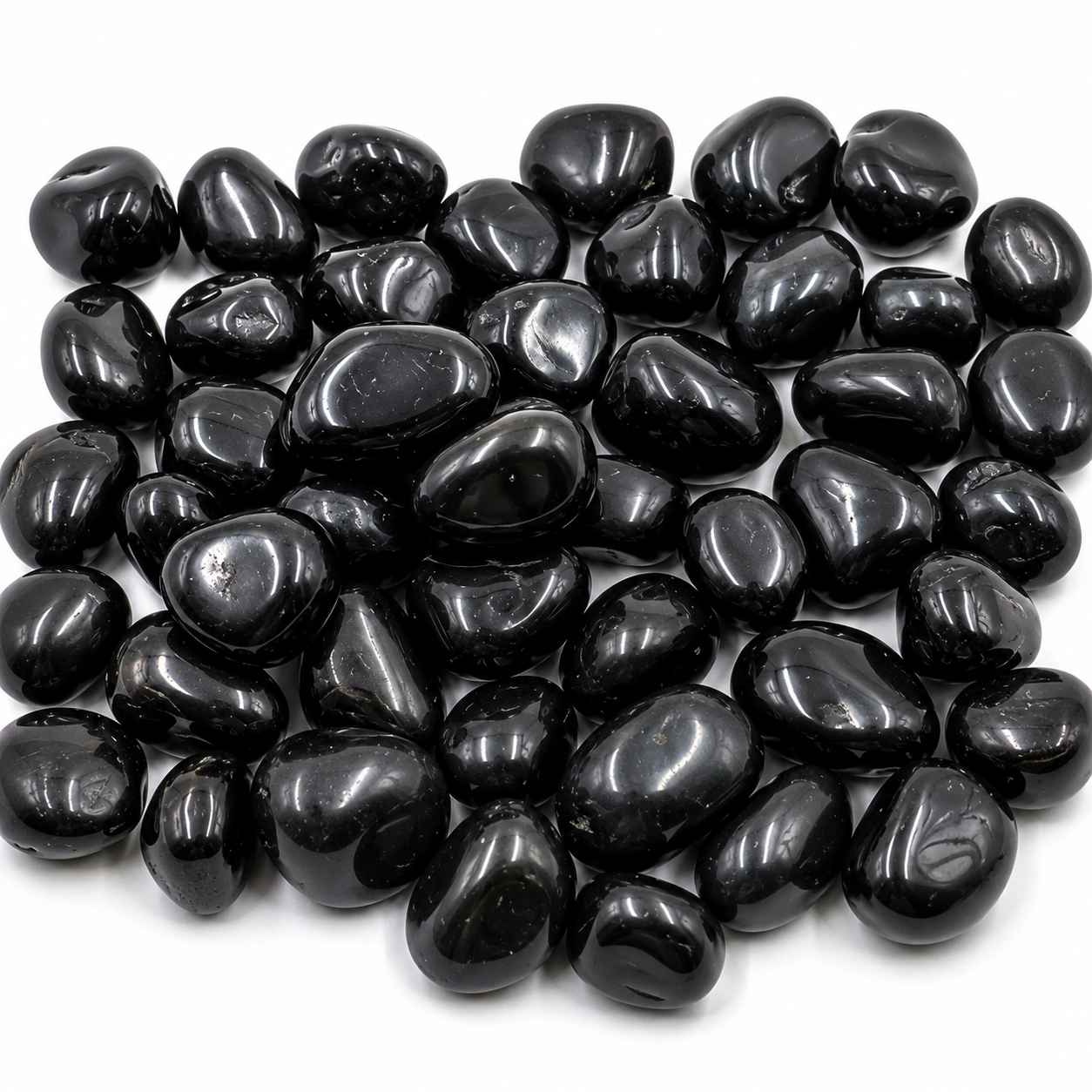 Black pebbles on a white background