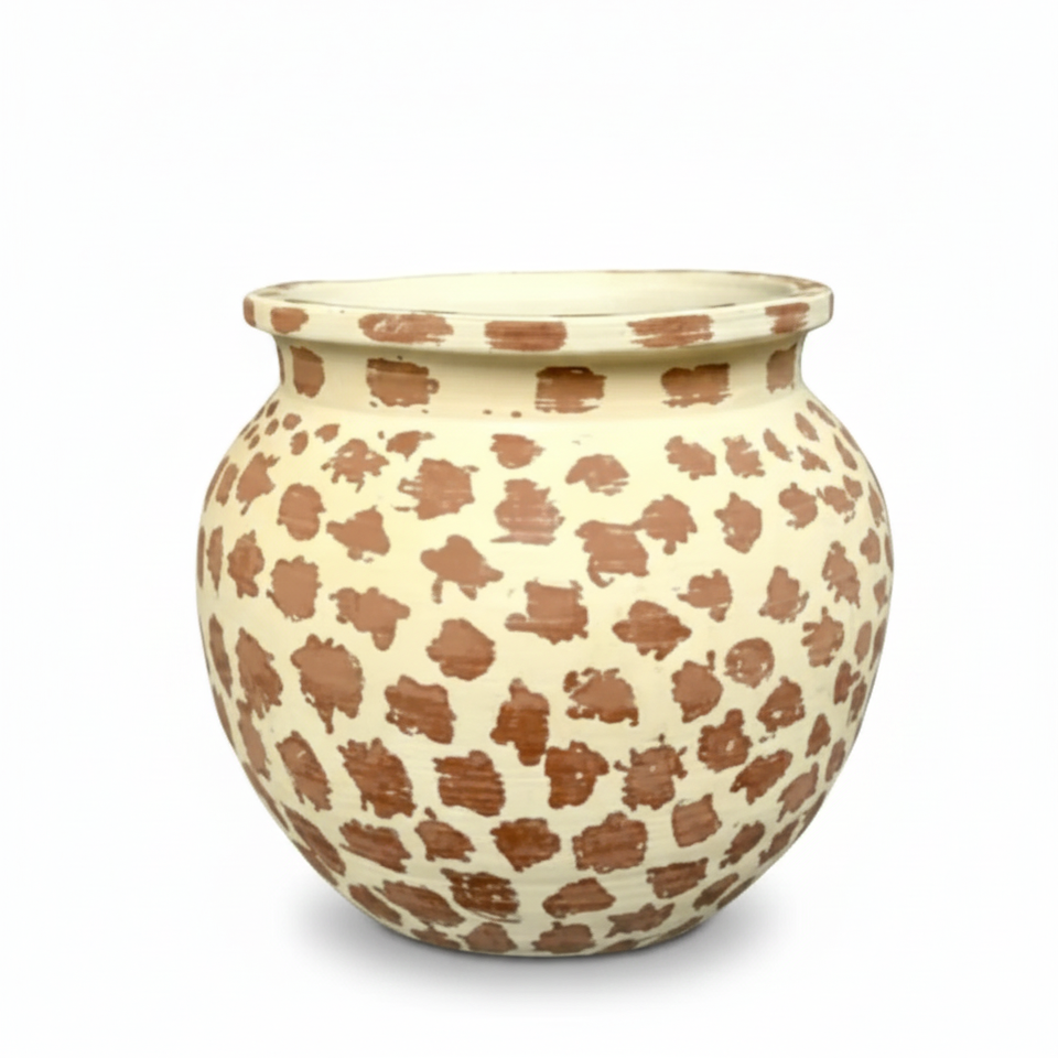Ceramic pot with brown abstract patterns on a white background